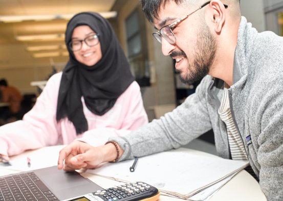 Smiling students study together